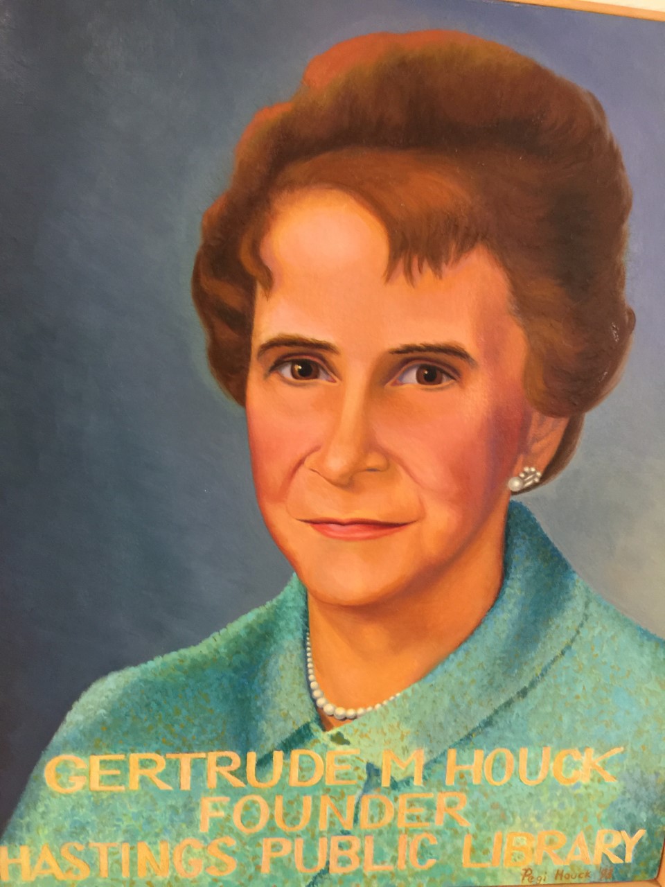 A painted portrait of Gertude Hauck, founder of Hastings Public Library